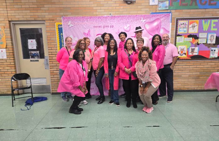  Staff members in all pink for breast cancer awareness